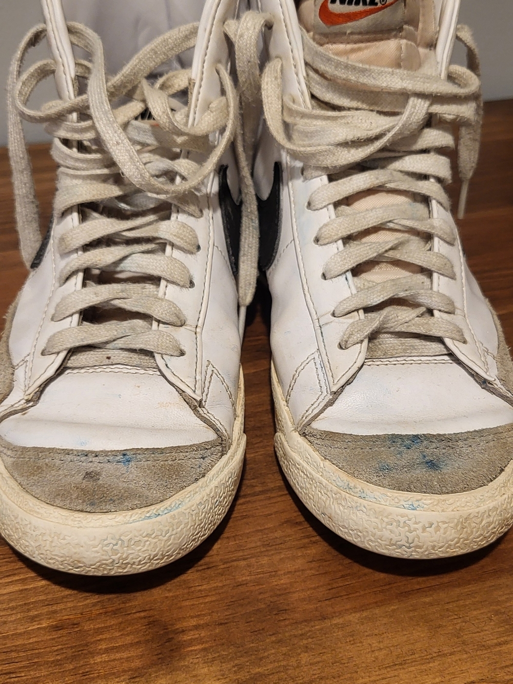Vintage White Nike High-Top Sneakers with Black Swoosh